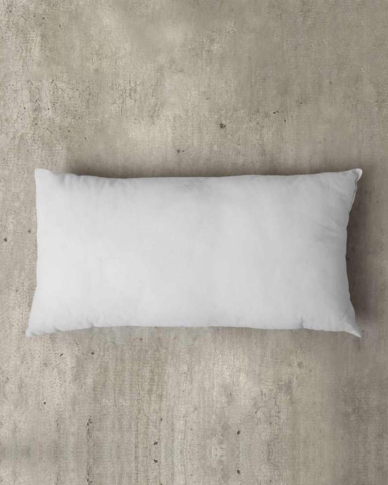 Overhead view of a white Pillow Filler 36 x 66 cm.