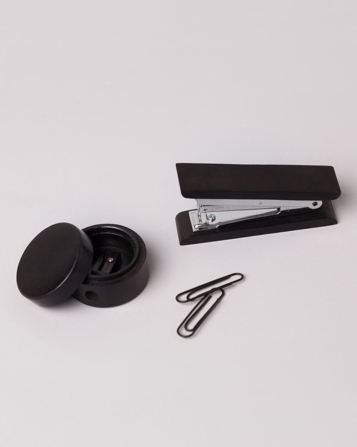 Colombo office set stapler, sharpener, and clips on a light grey surface.
