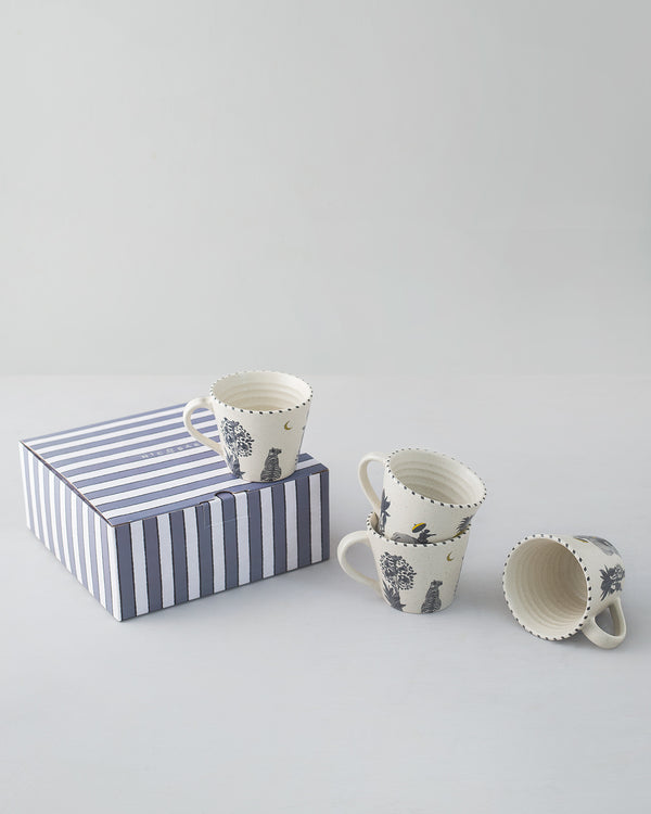 The mugs grouped beside the striped box