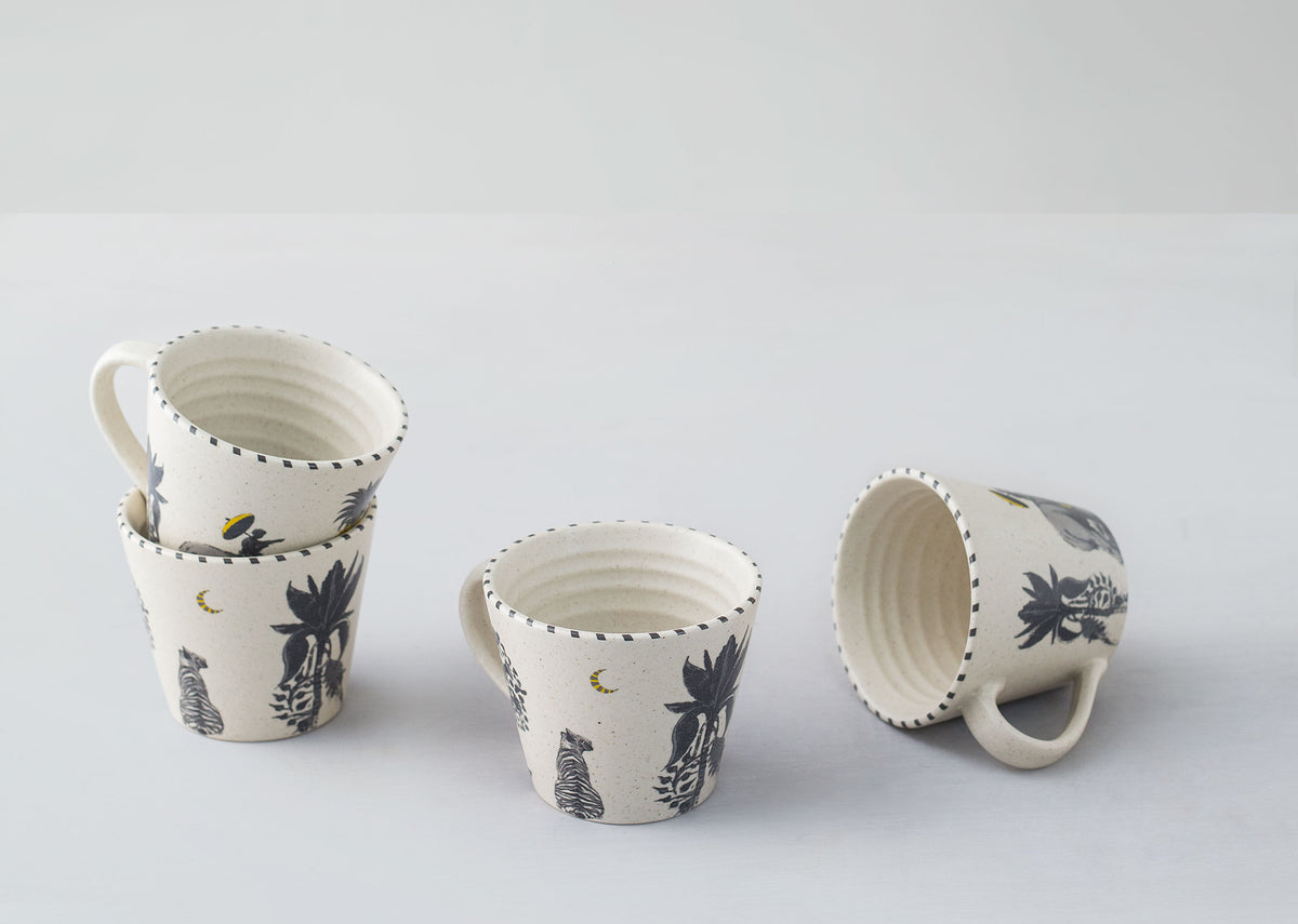 Four Haathi Sher Espresso Mugs grouped together, one turned to show its inside.