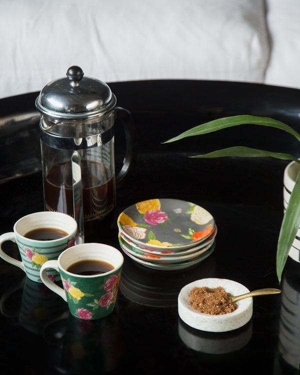 Mugs on a tray with coffee