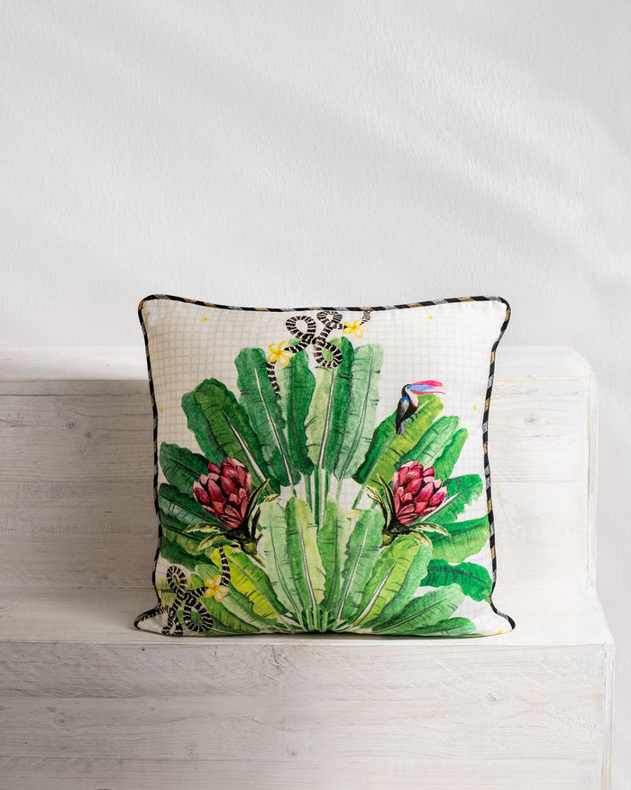 Madagascar cushion cover with green leaves, red proteas and a toucan.