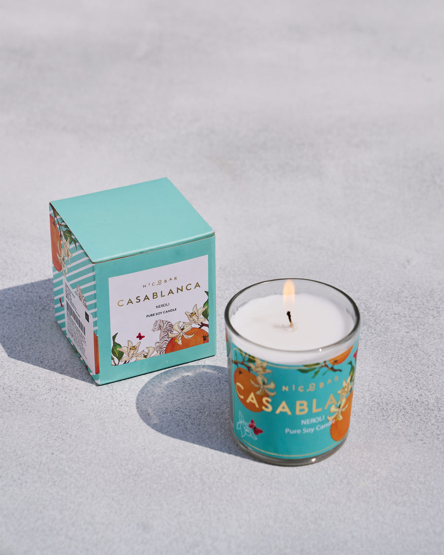 The Casablanca Jar Candle beside its turquoise box.