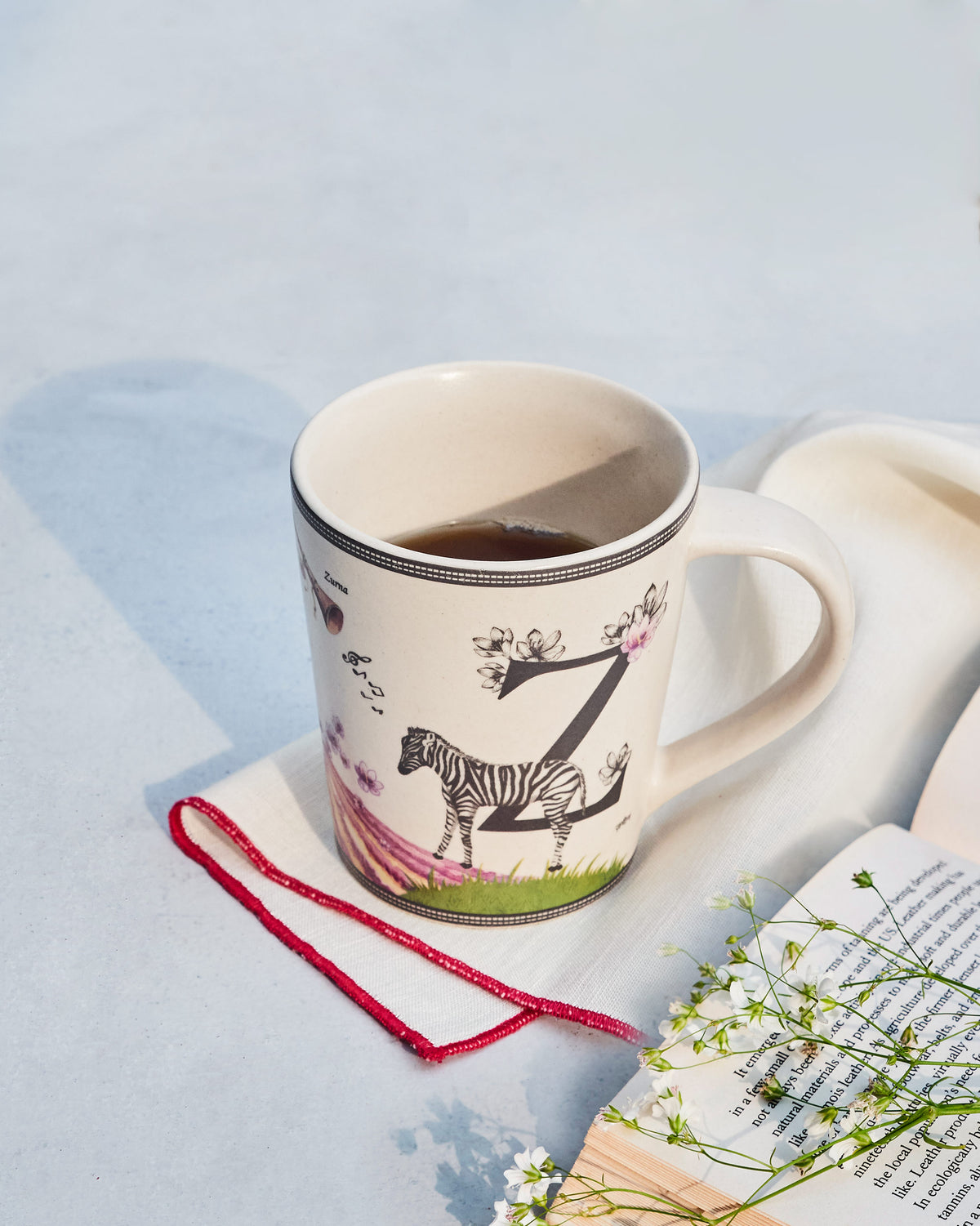 The Zafran Mug filled with coffee on a napkin.