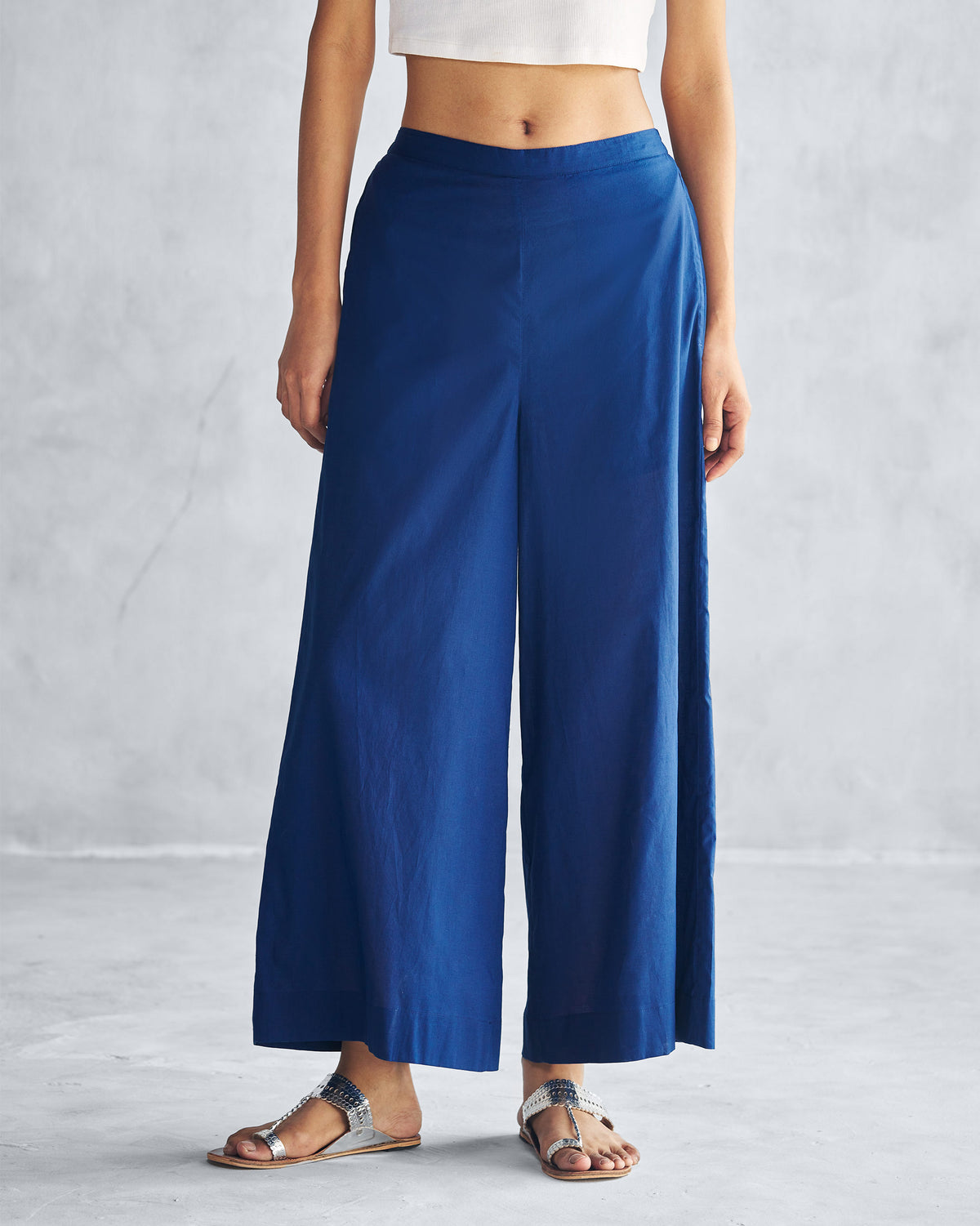 Person wearing navy Basic Pyjamas with wide legs.