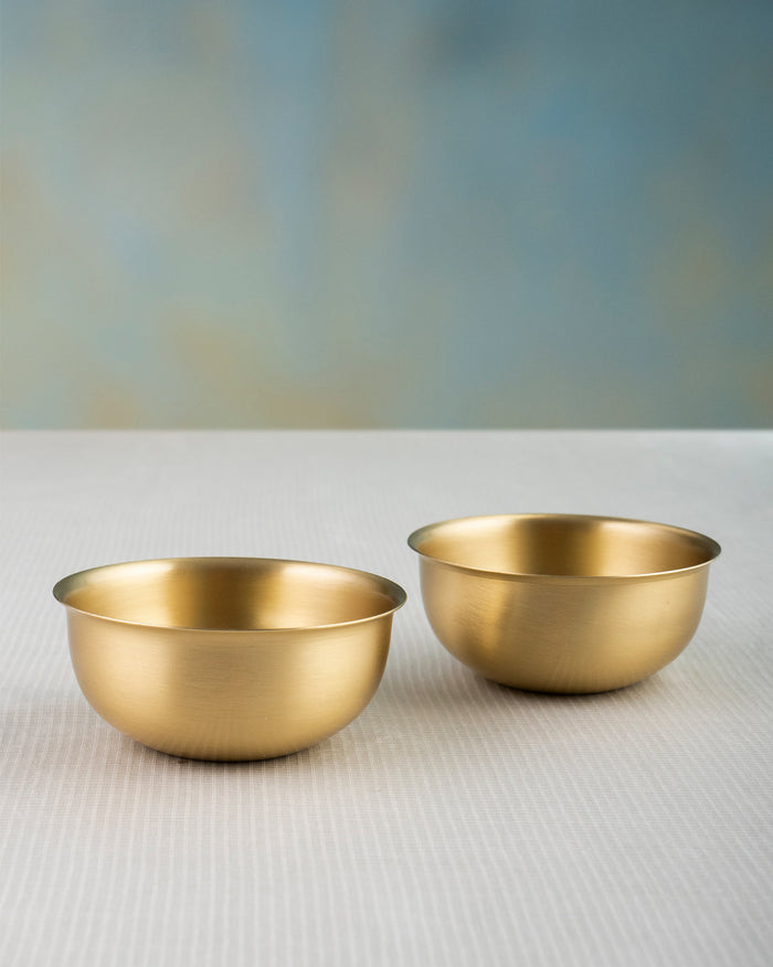 Pair of brushed gold Madhu brass dessert bowls.