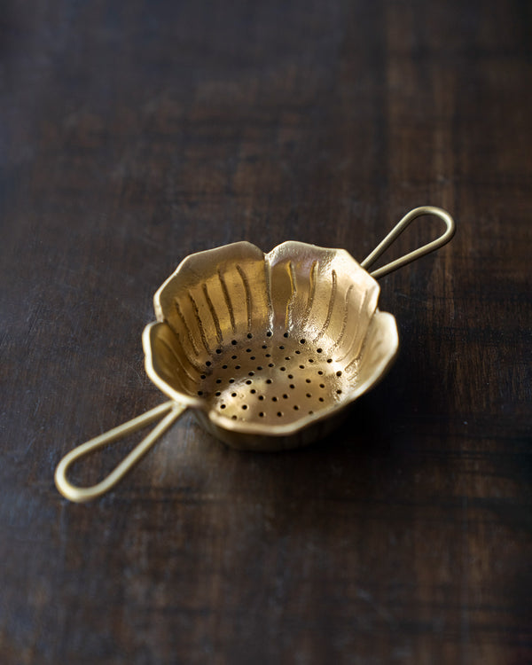 The strainer from above, petals and pierced base