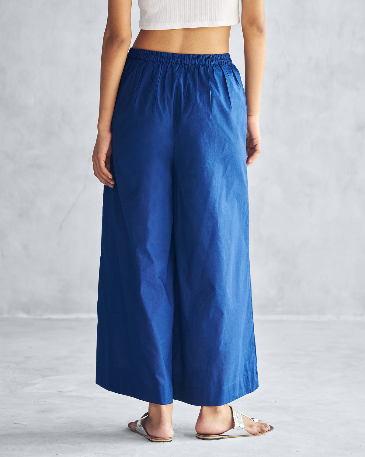 Back of navy Basic Pyjamas worn by a person.