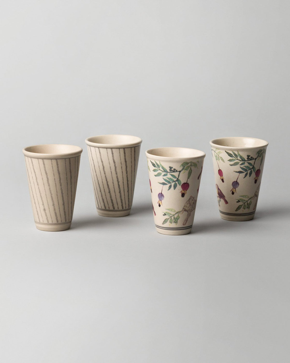 Row of four Nakano kulhars in pinstripe and botanical prints.