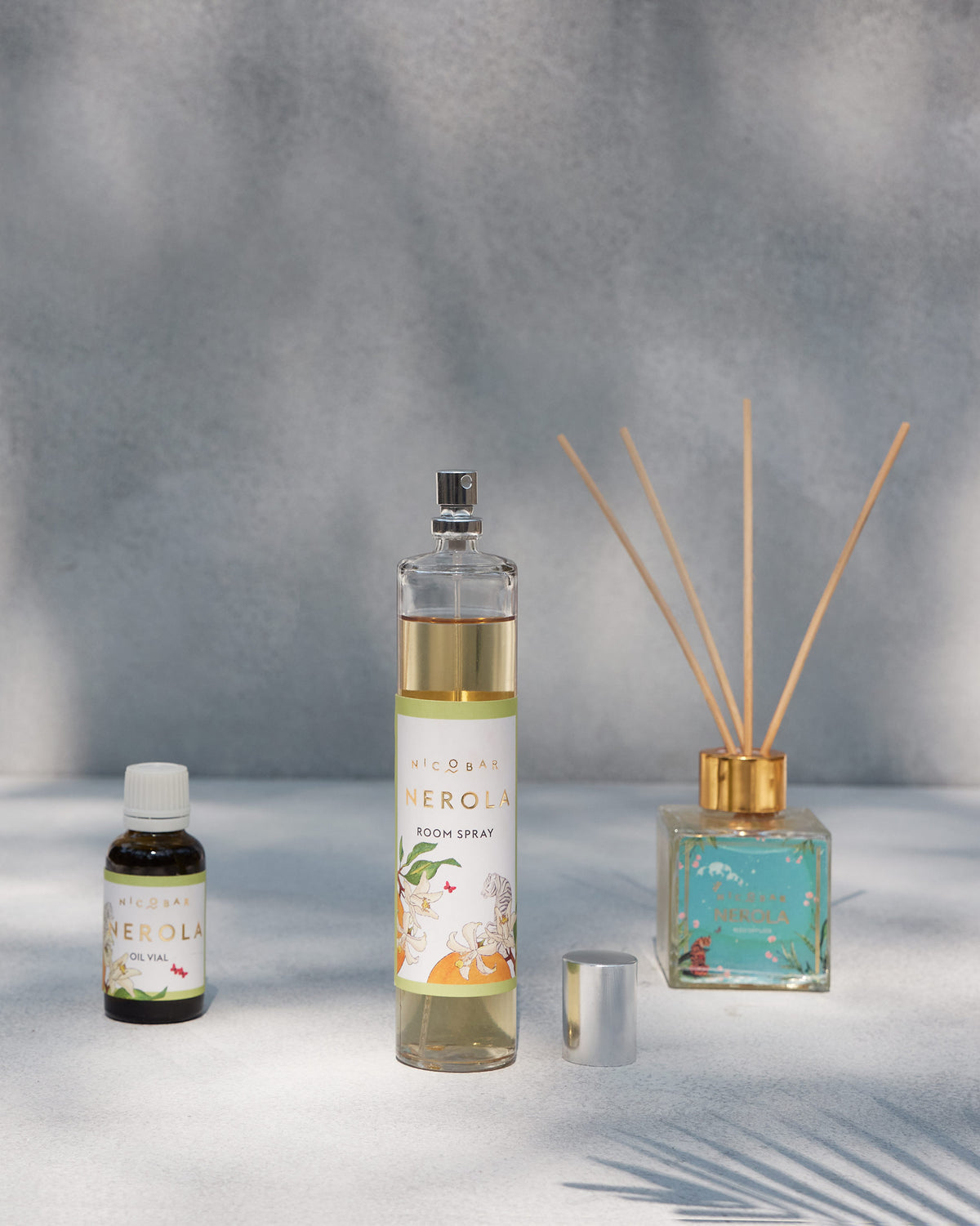 Nerola reed diffuser beside a room spray and oil vial.