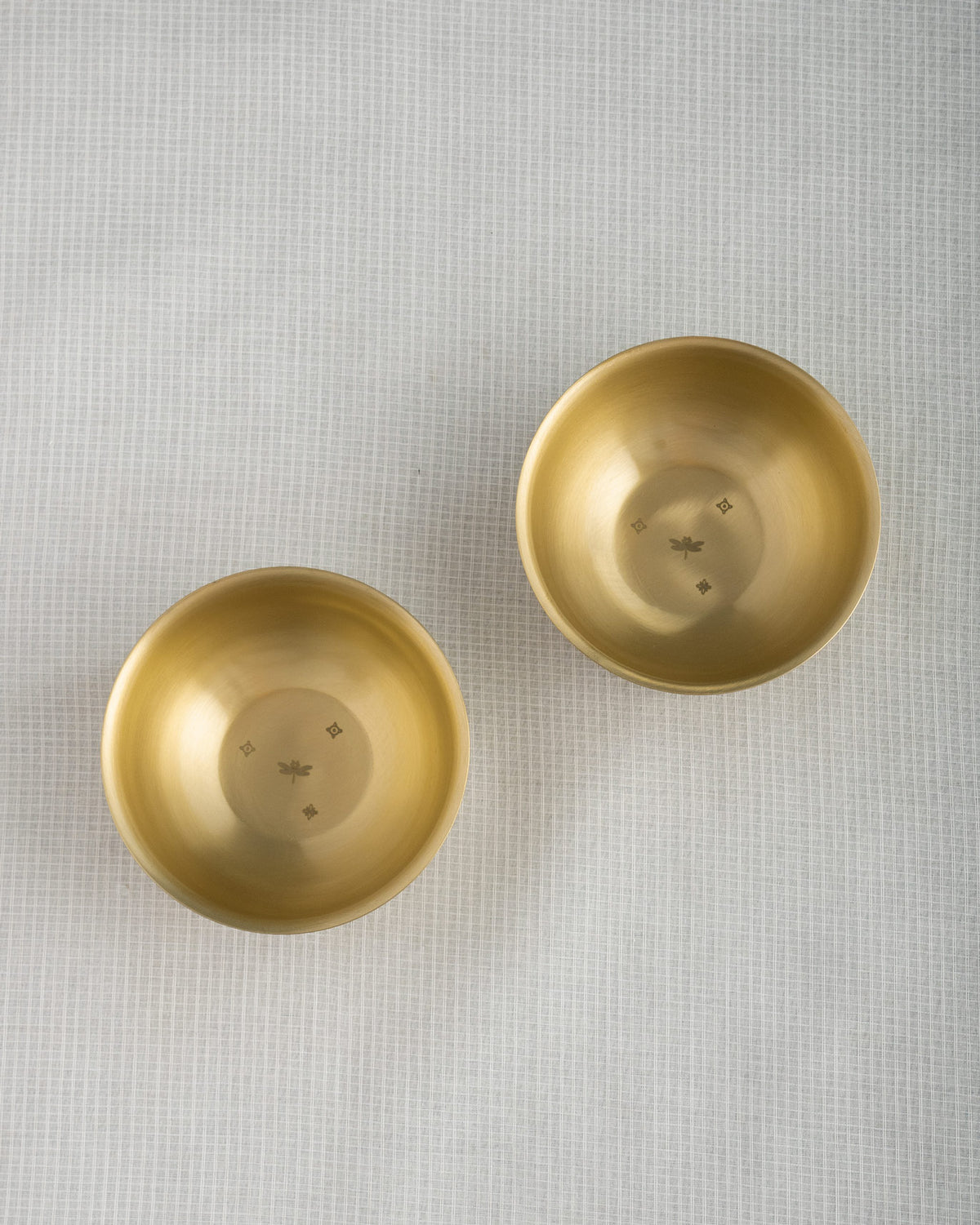 Pair of Madhu brass dessert bowls with matching dragonfly etchings.
