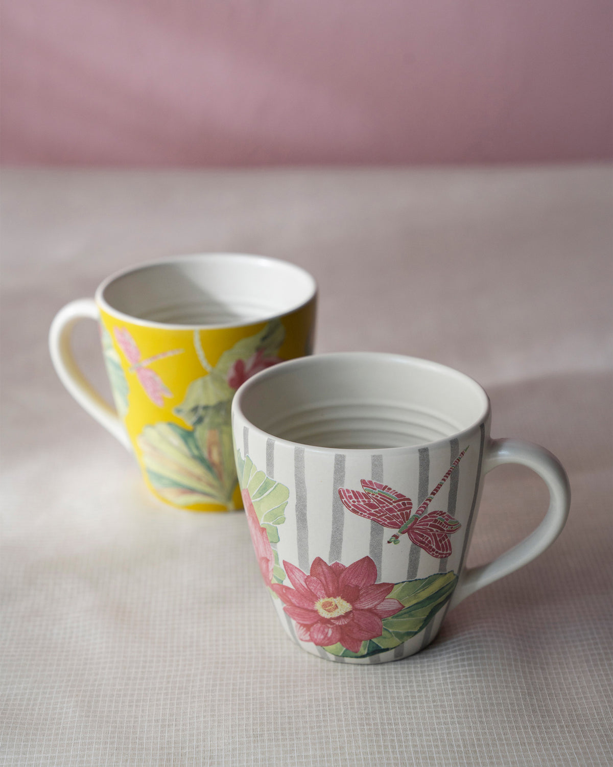 Lotus Garden mug pair with pink lotus, dragonfly and yellow botanical prints.