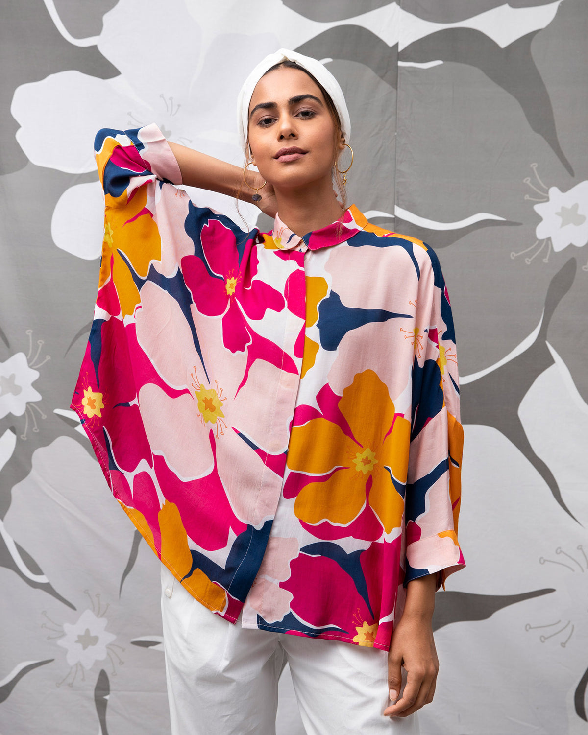 Person wearing the Boxy Shirt in a pink and orange floral print.