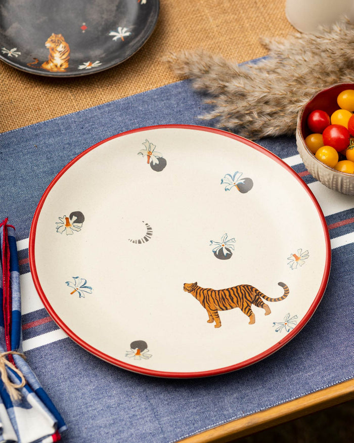 Jheel Dinner Plate with a red rim and an orange and black tiger.