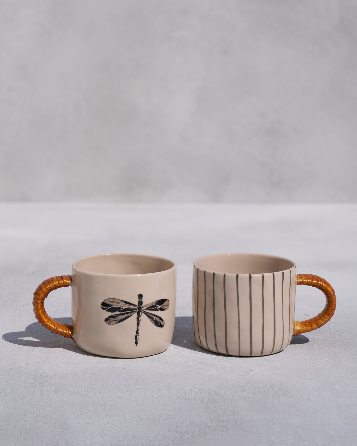 The pair of Dragonfly Mugs with wildgrass handles.