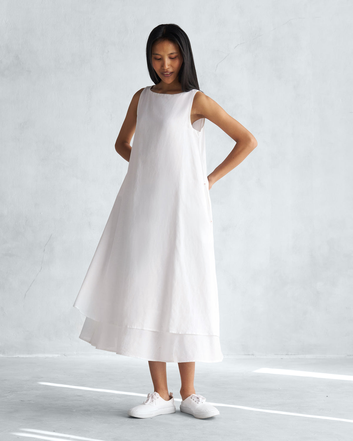 Person wearing a white Double layer dress with a flared A-line silhouette.