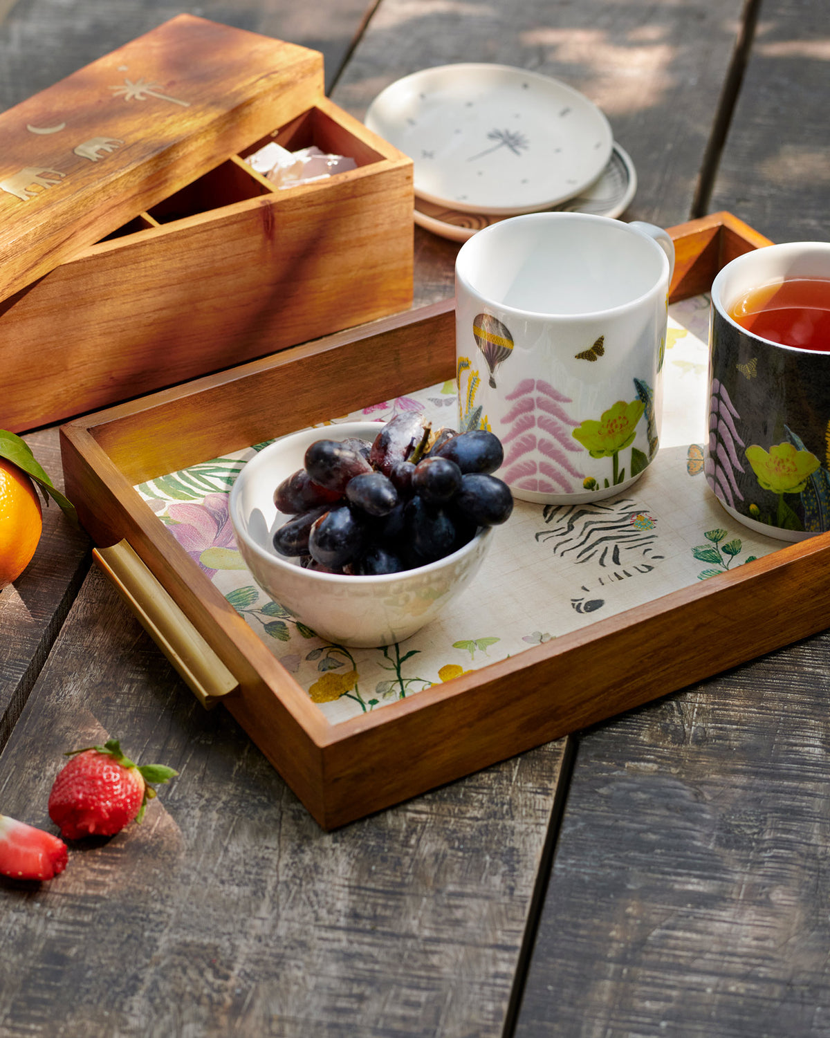Waadi Rectangle Tray in use, with a floral print on its base.