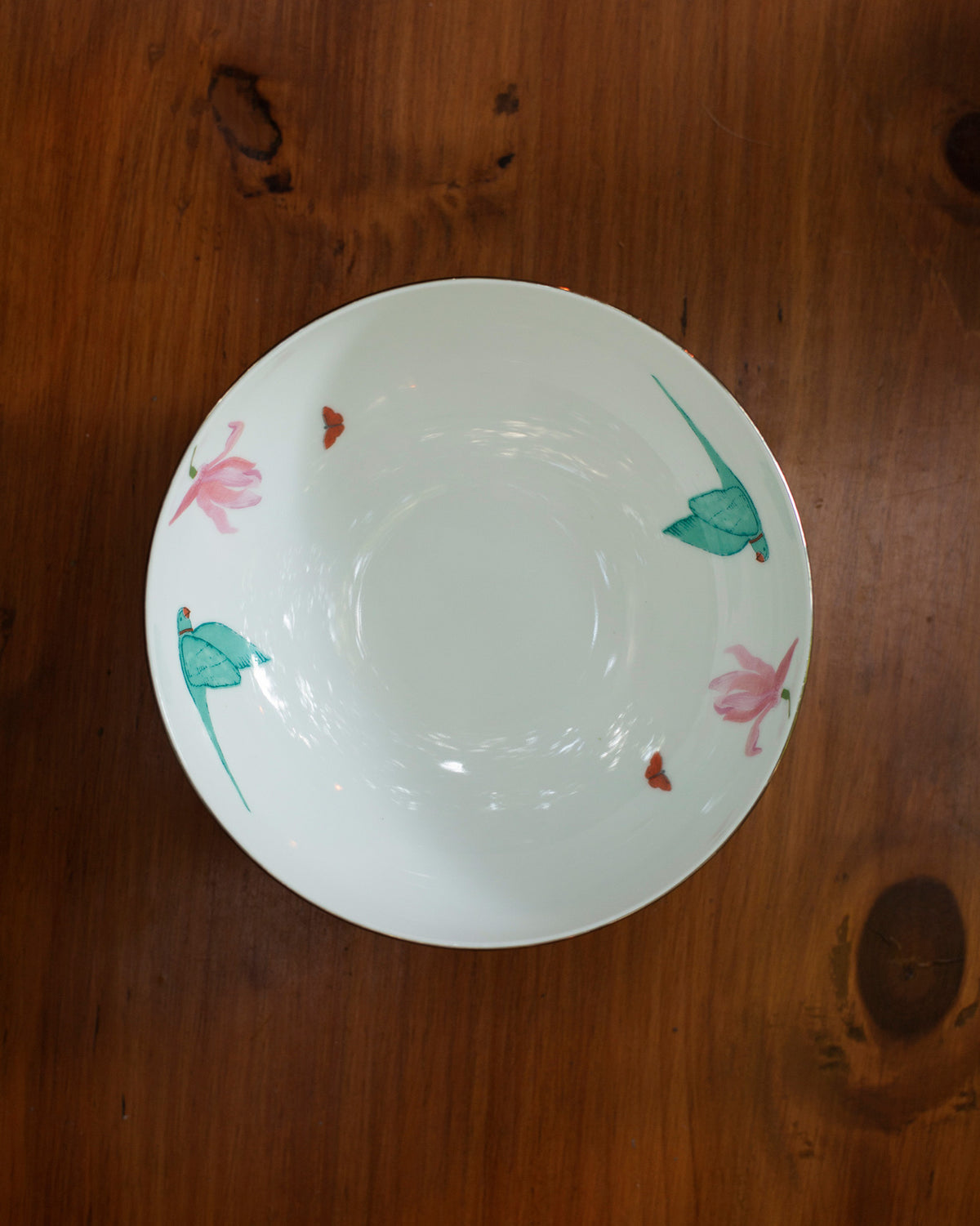 Overhead view of the Botanical Serving bowl small with bird and flower motifs.
