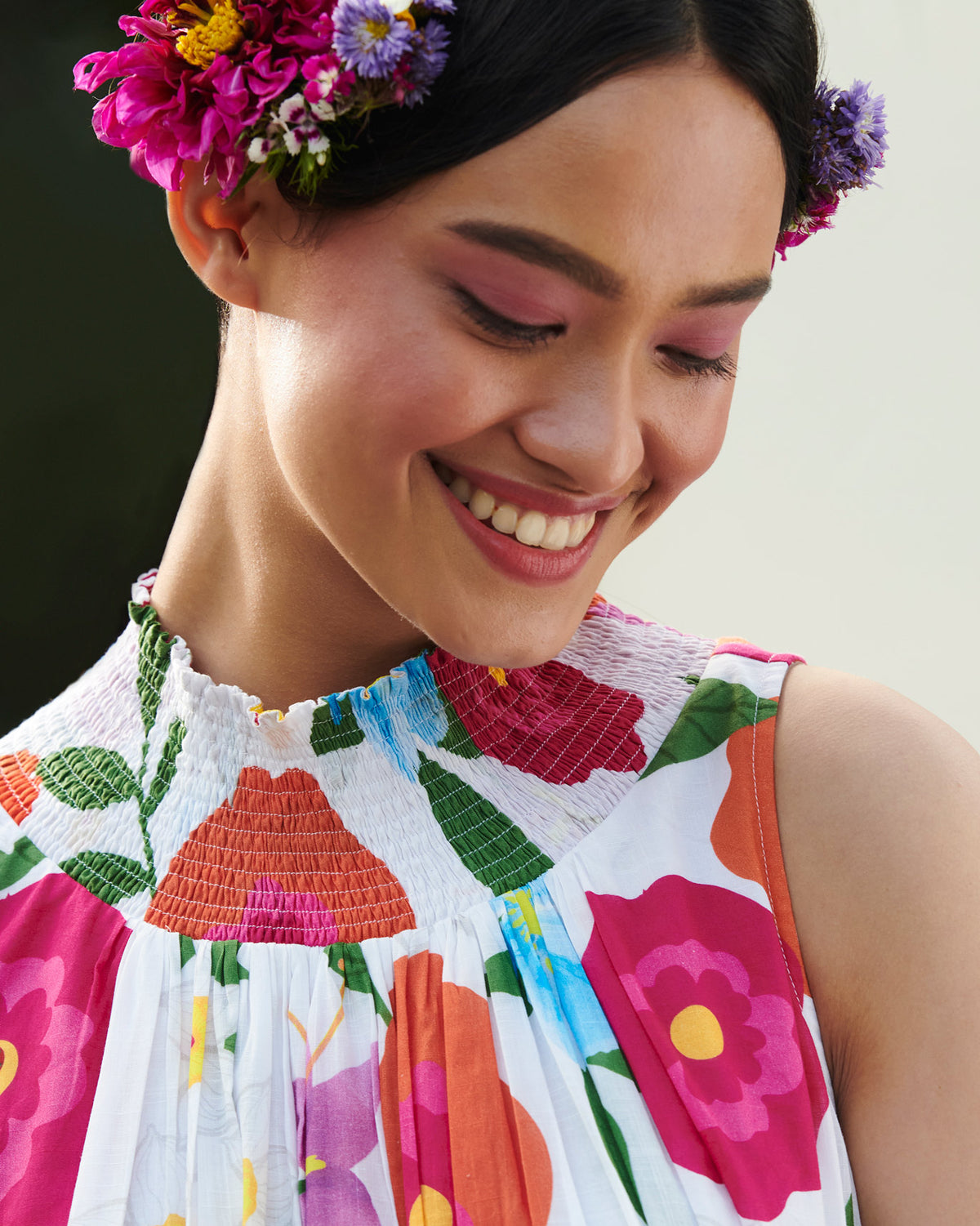 Close-up of a smocked neck dress showing the gathered smocking at the neckline.
