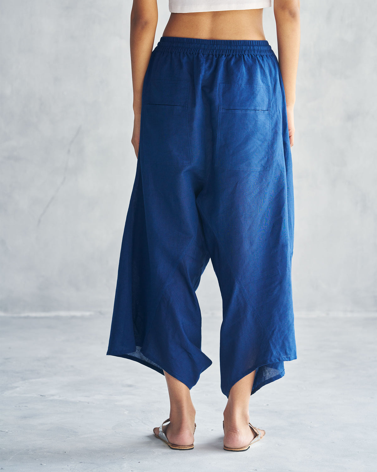 Back of navy Yoka Trousers with patch pockets.