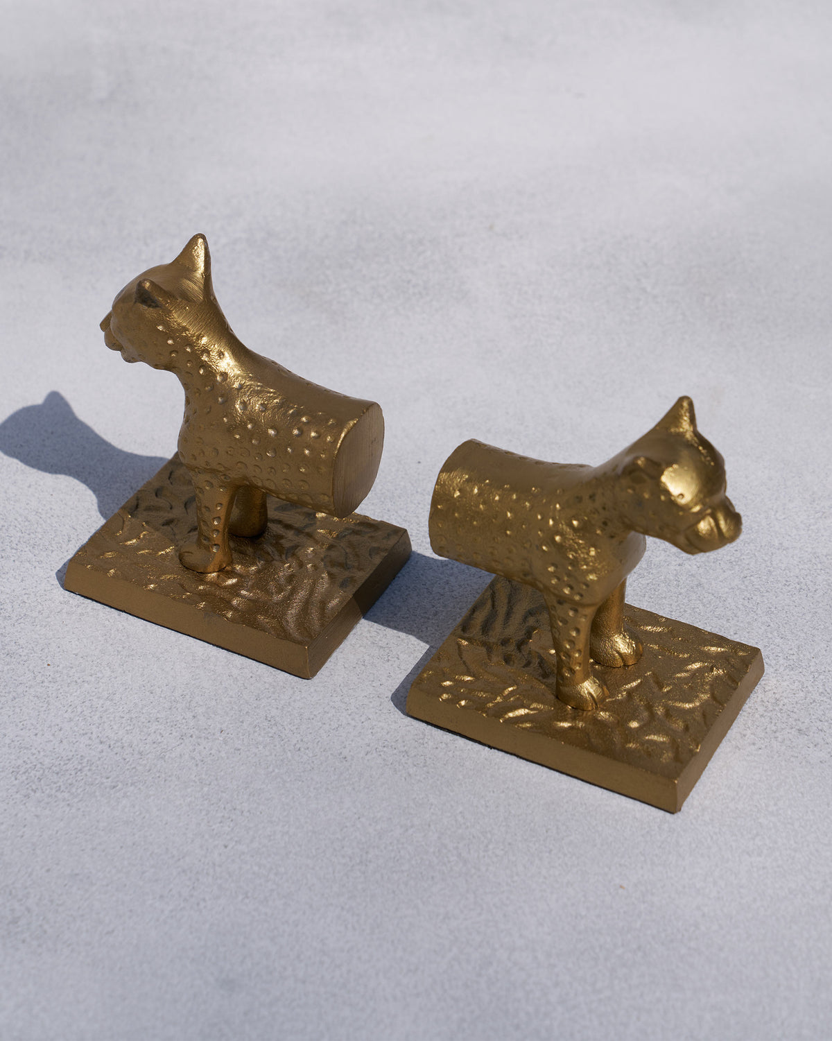 Angled view of Leopard Bookends showing their spotted texture.