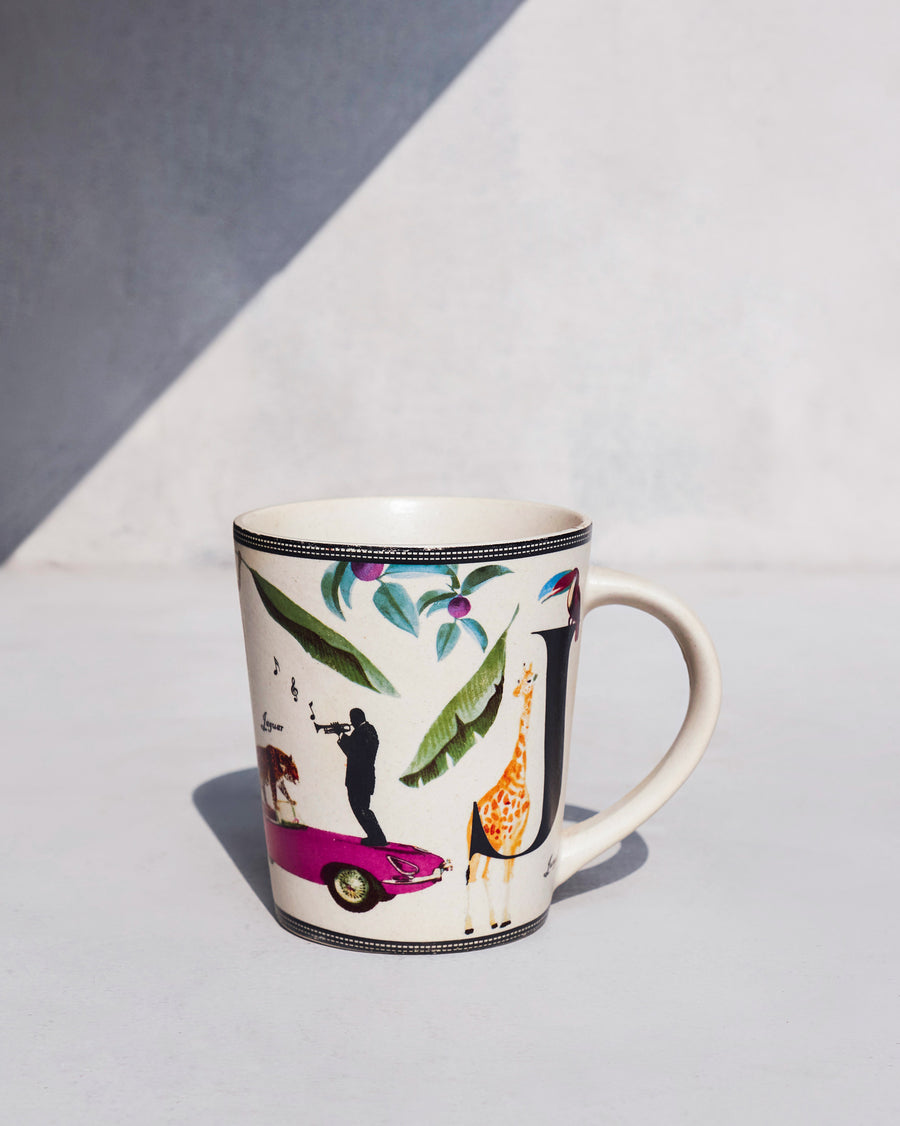 The Jungle Mug side-on, with a pink car and a giraffe.