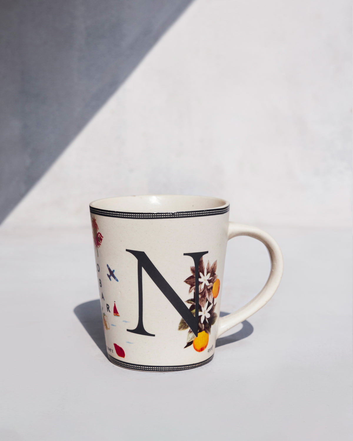 The charcoal N with orange blossom.