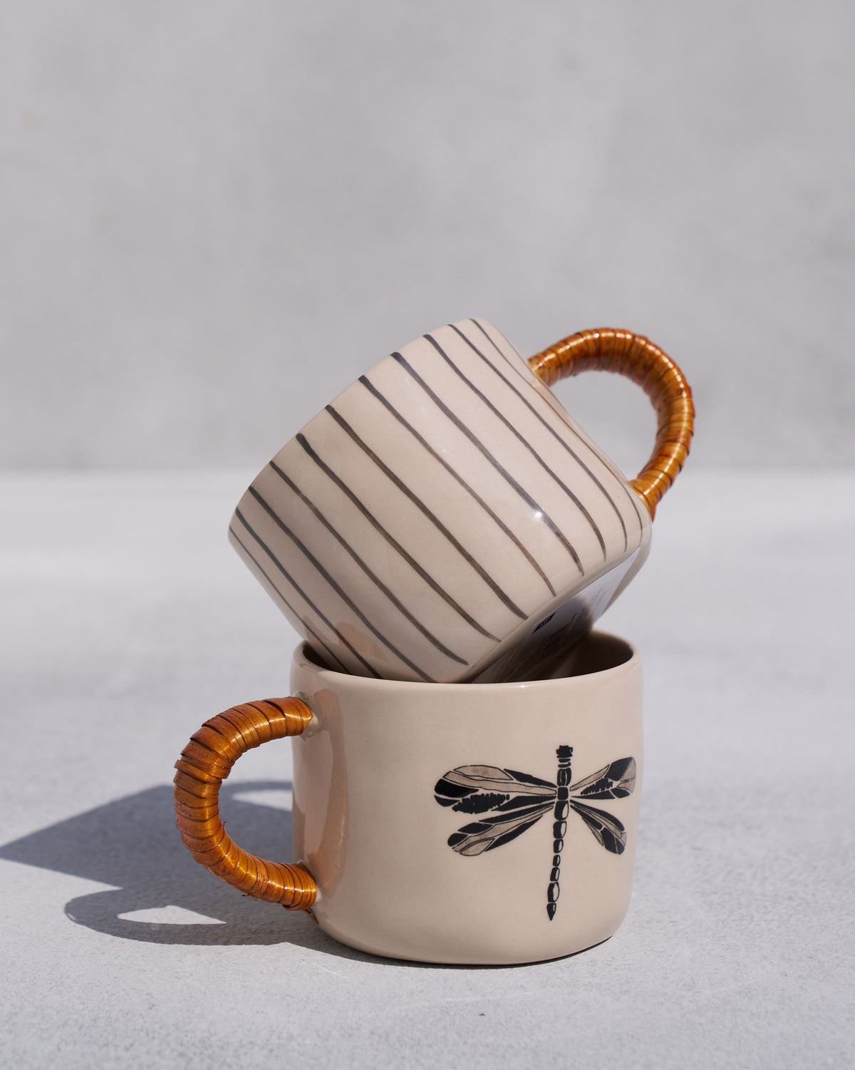 The two mugs stacked.