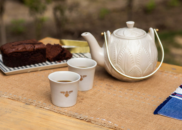 The teapot and cups on a table