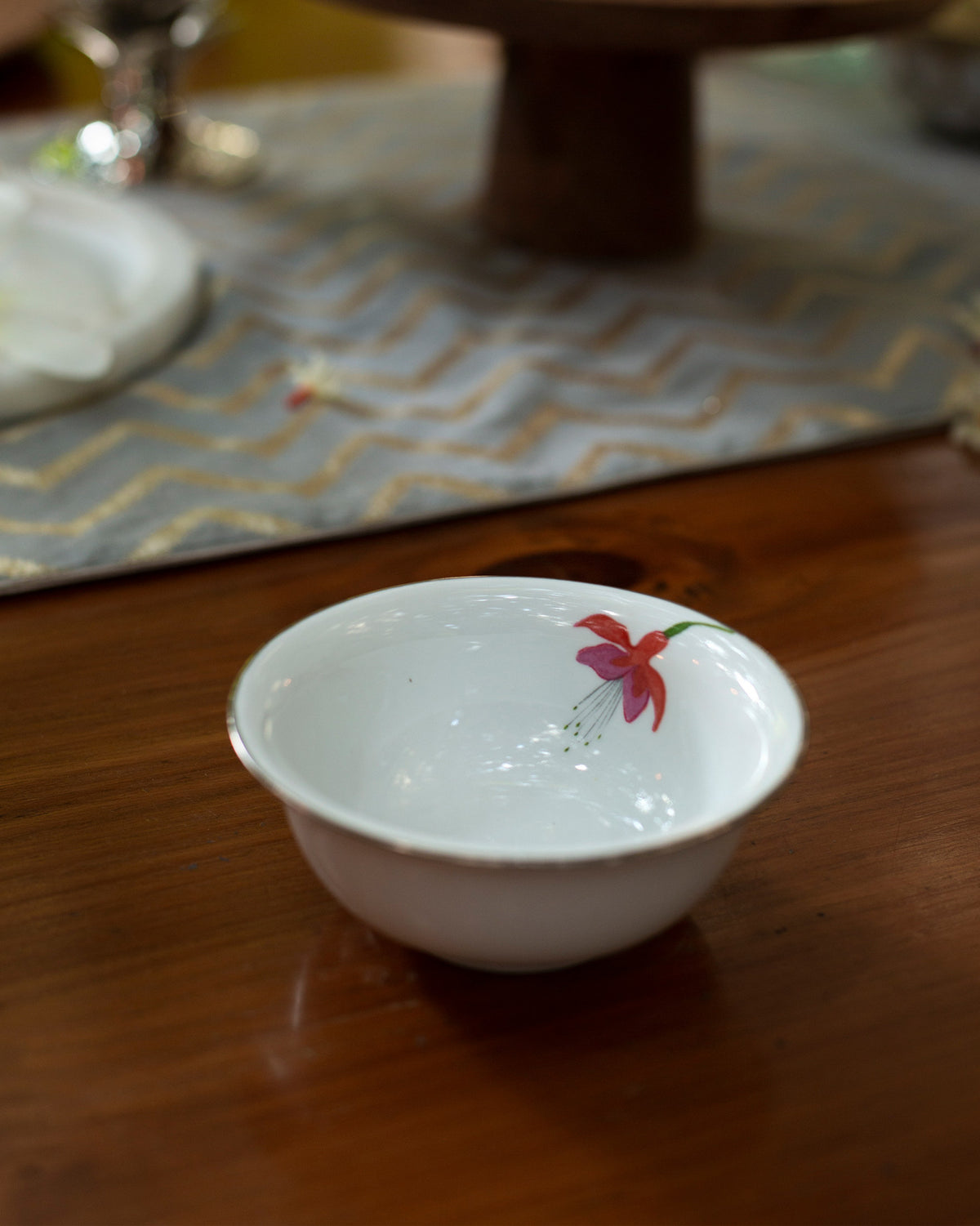 Botanical Katori with a red fuchsia flower painted on the inside.
