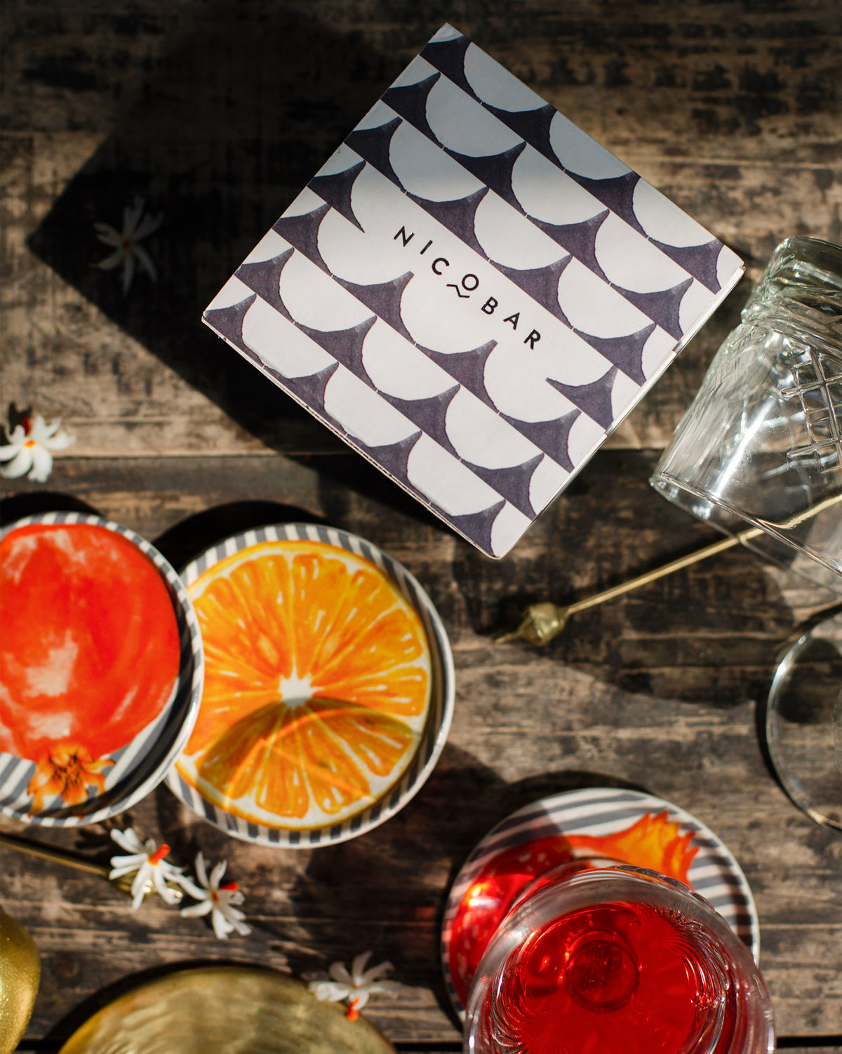 Nimbu & Anar coasters beside their patterned gift box.