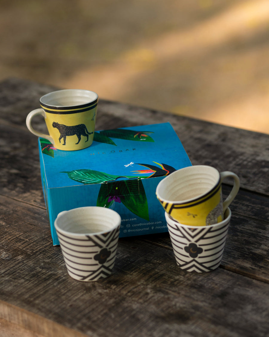 The mugs on a blue box.