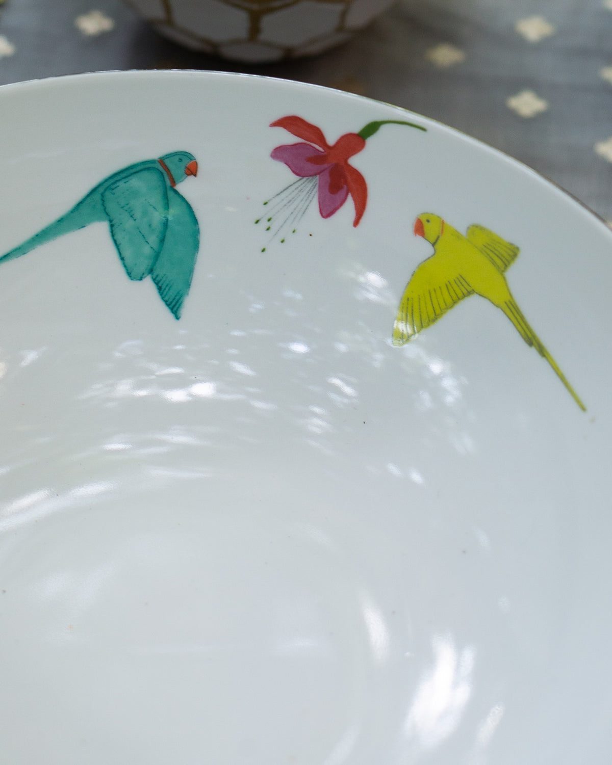 Close-up of Botanical Serving bowl large showing a teal bird and pink flower.