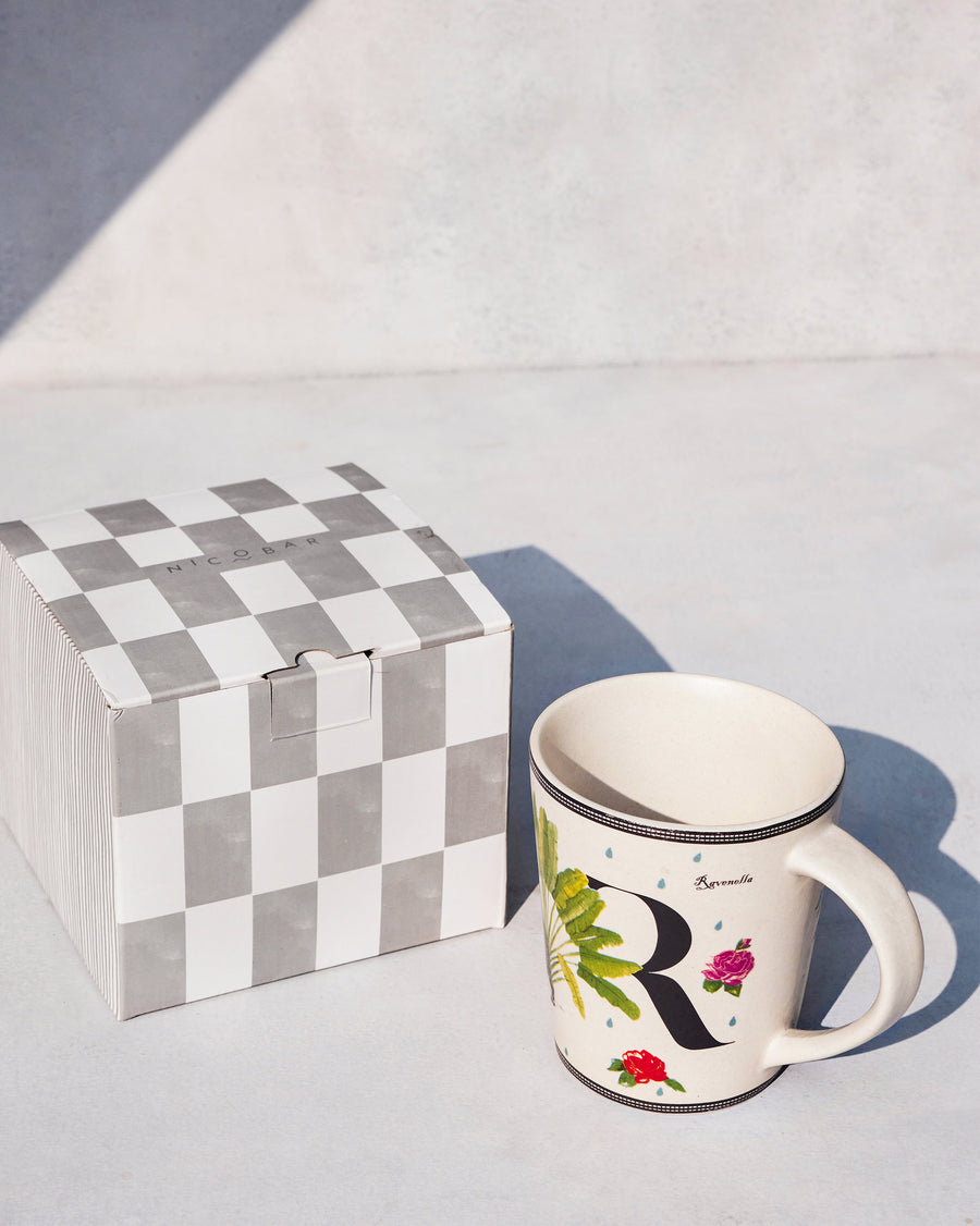 The Ravenala Mug beside its chequered Nicobar gift box.