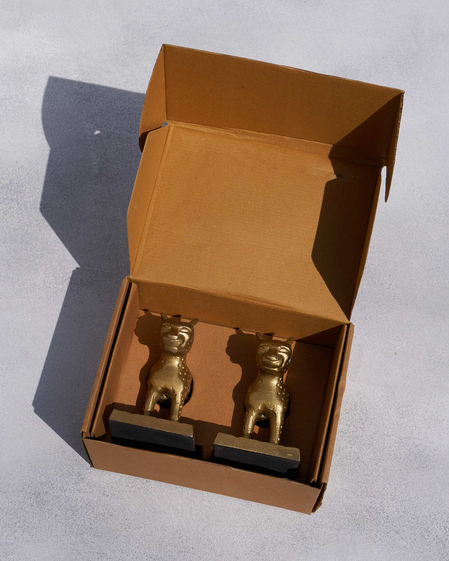 The Leopard Bookends in their open box.