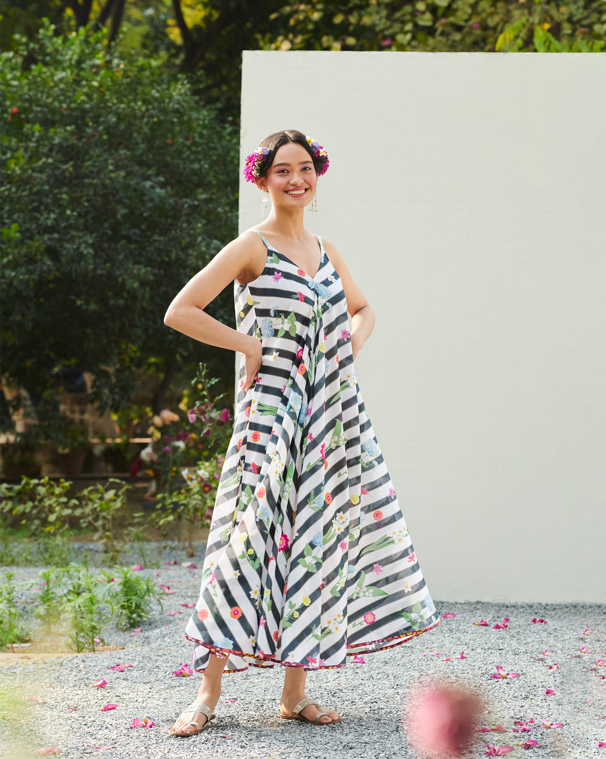 Person wearing a black and white striped floral V-neck maxi dress.